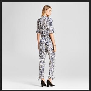 Leaf printed jumpsuit with lace insets